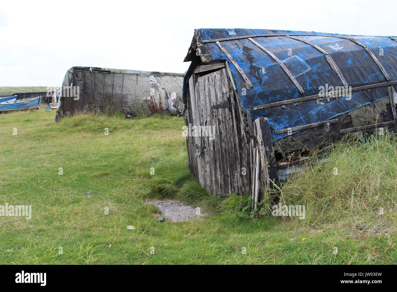 Barche capovolta per le strutture di memorizzazione, Lindisfarne Foto Stock