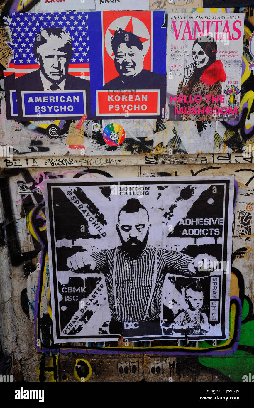 Protesta politica graffiti su un muro off Brick Lane nell'East End di Londra Foto Stock