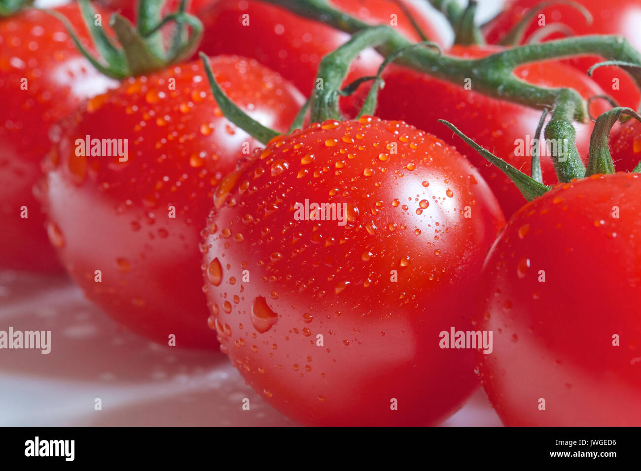 I pomodori sono una fonte eccellente di vitamina C Foto Stock