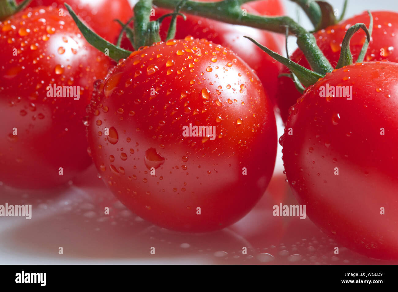 I pomodori sono una fonte eccellente di vitamina C Foto Stock