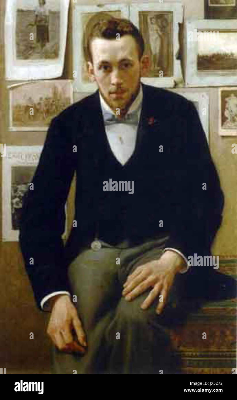 Jef Leempoels uomo seduto di fronte a un muro decorate con stampe e disegni Foto Stock
