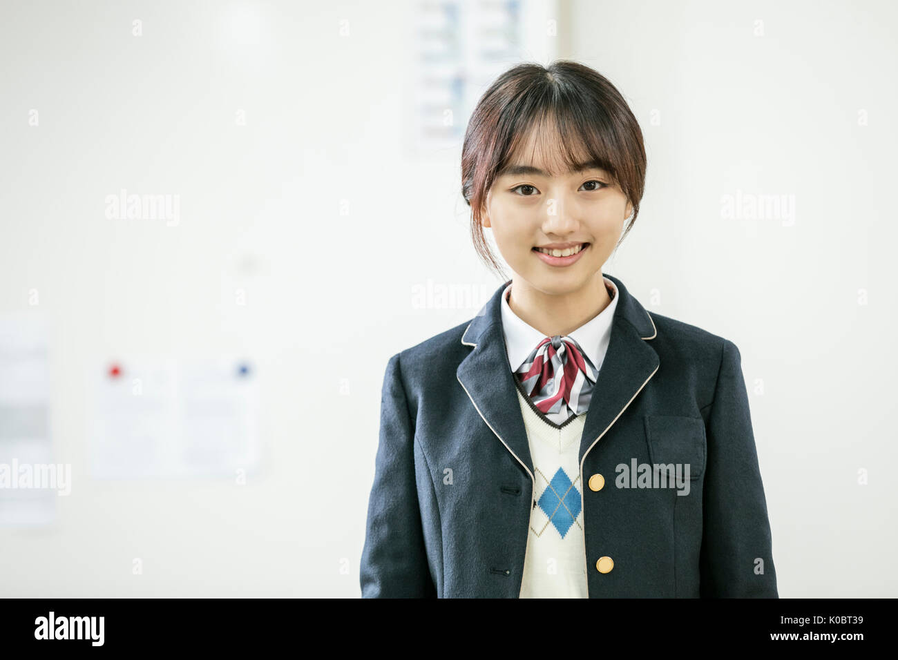 Ritratto di scuola sorridente ragazza Foto Stock