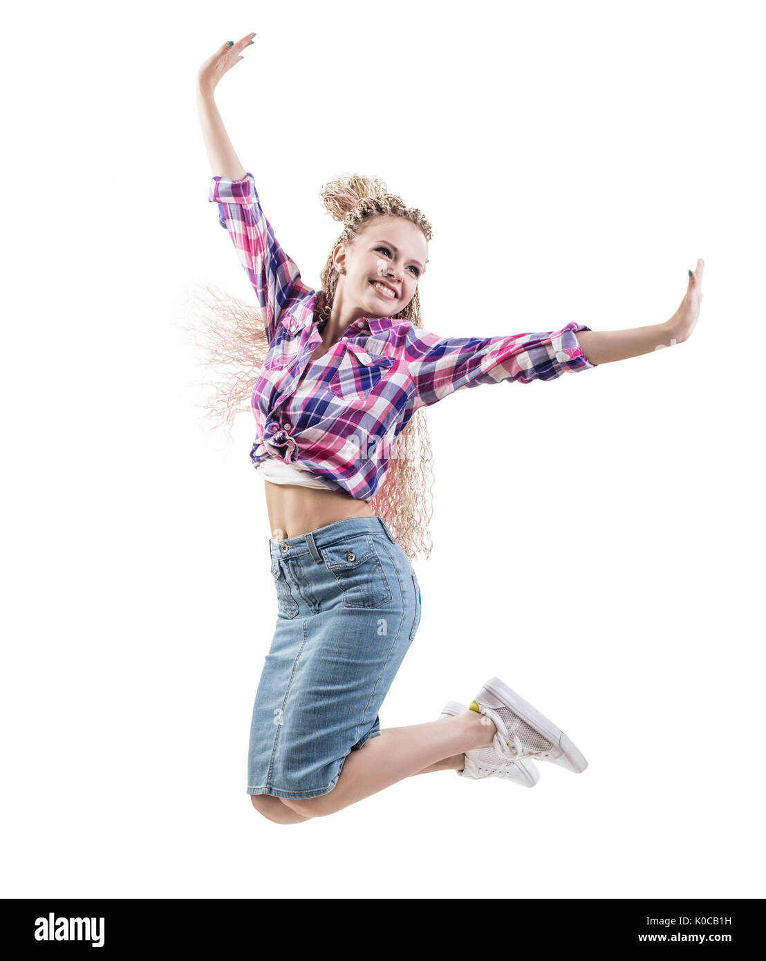 Felice giovane donna jumping. Foto Stock