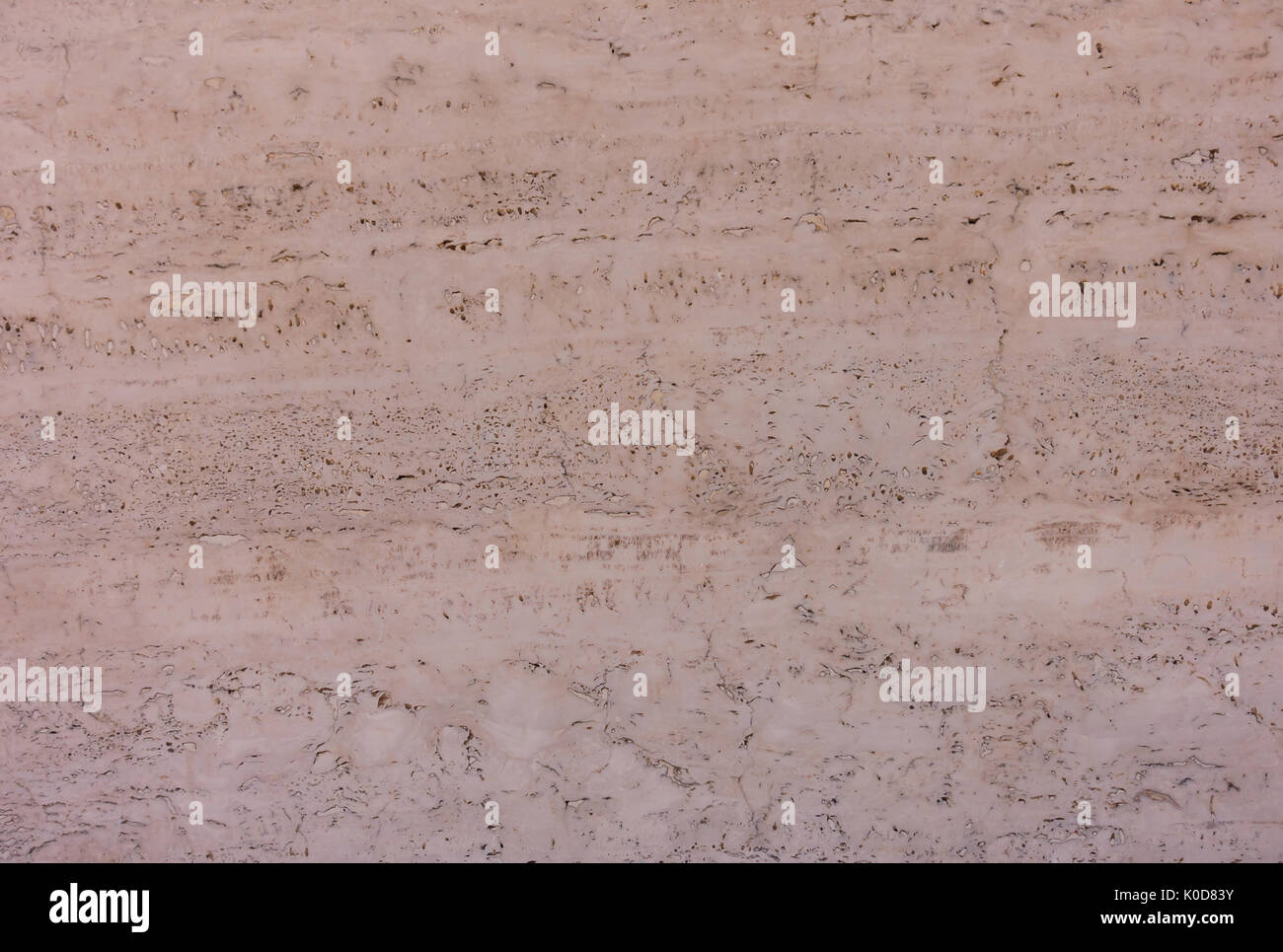 Primo piano di un Marocchino Rosso fango di Adobe a muro come sfondo. Foto Stock