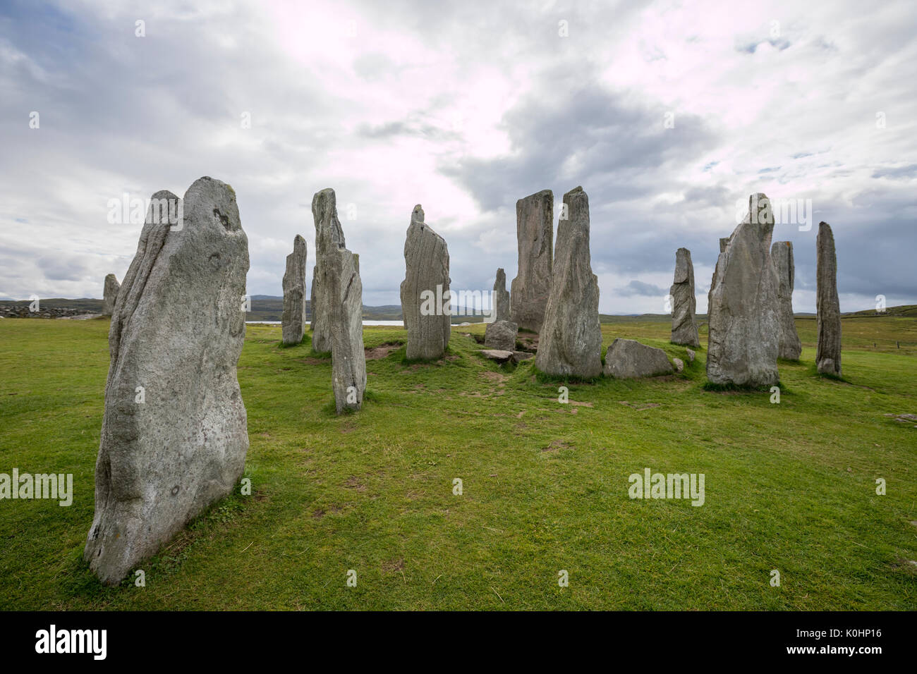 Callanish pietre in piedi in un giorno nuvoloso, , pietre permanente posto in una configurazione a croce con al centro un cerchio di pietra, Callanish, Scotland, Regno Unito Foto Stock