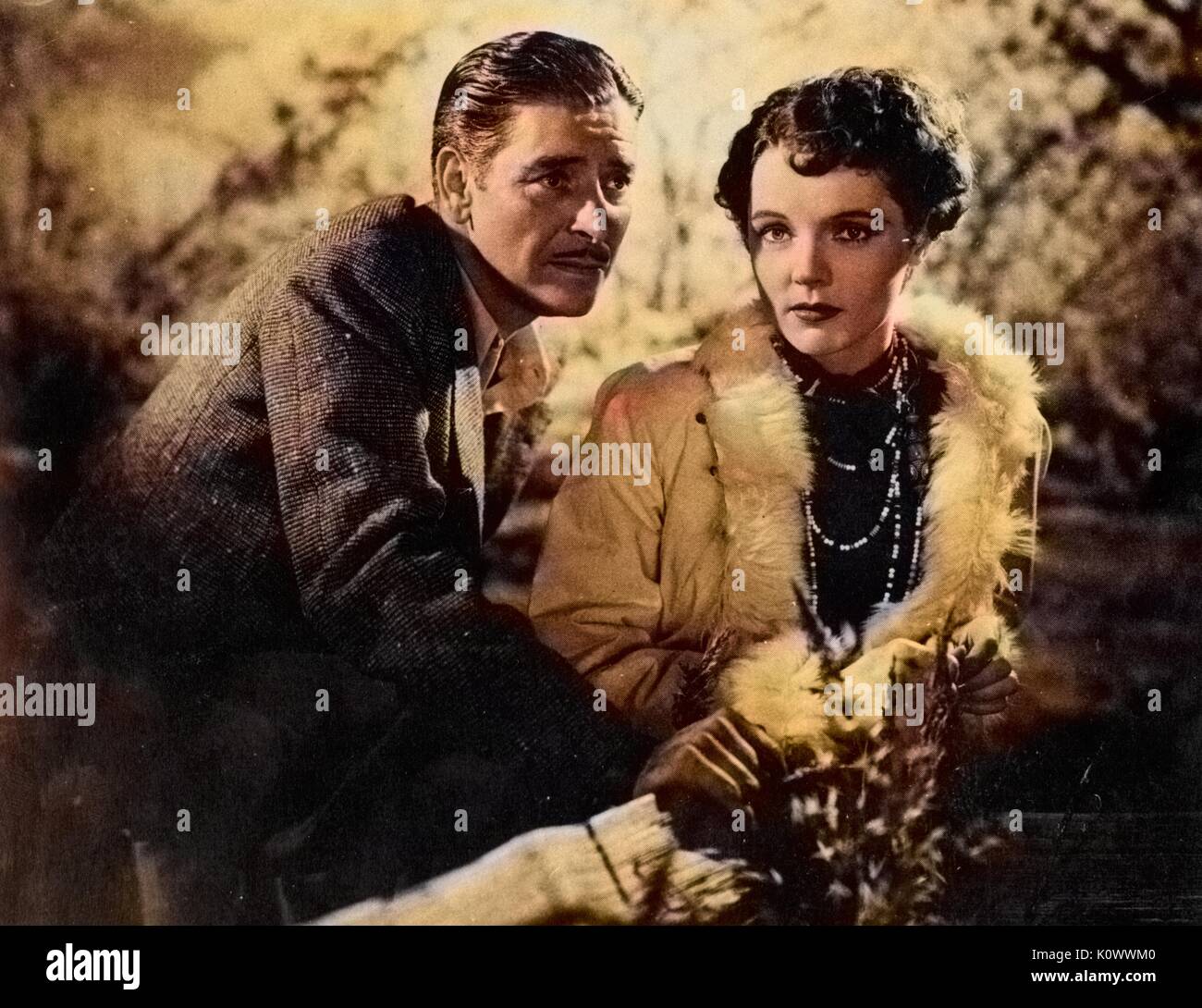 Ronald Colman e Jane Wyatt nel 1937 film orizzonte perduto 1937. NOTA: l'immagine è stato colorizzato digitalmente usando un processo moderno. i colori potrebbero non essere periodo-precisa. Foto Stock