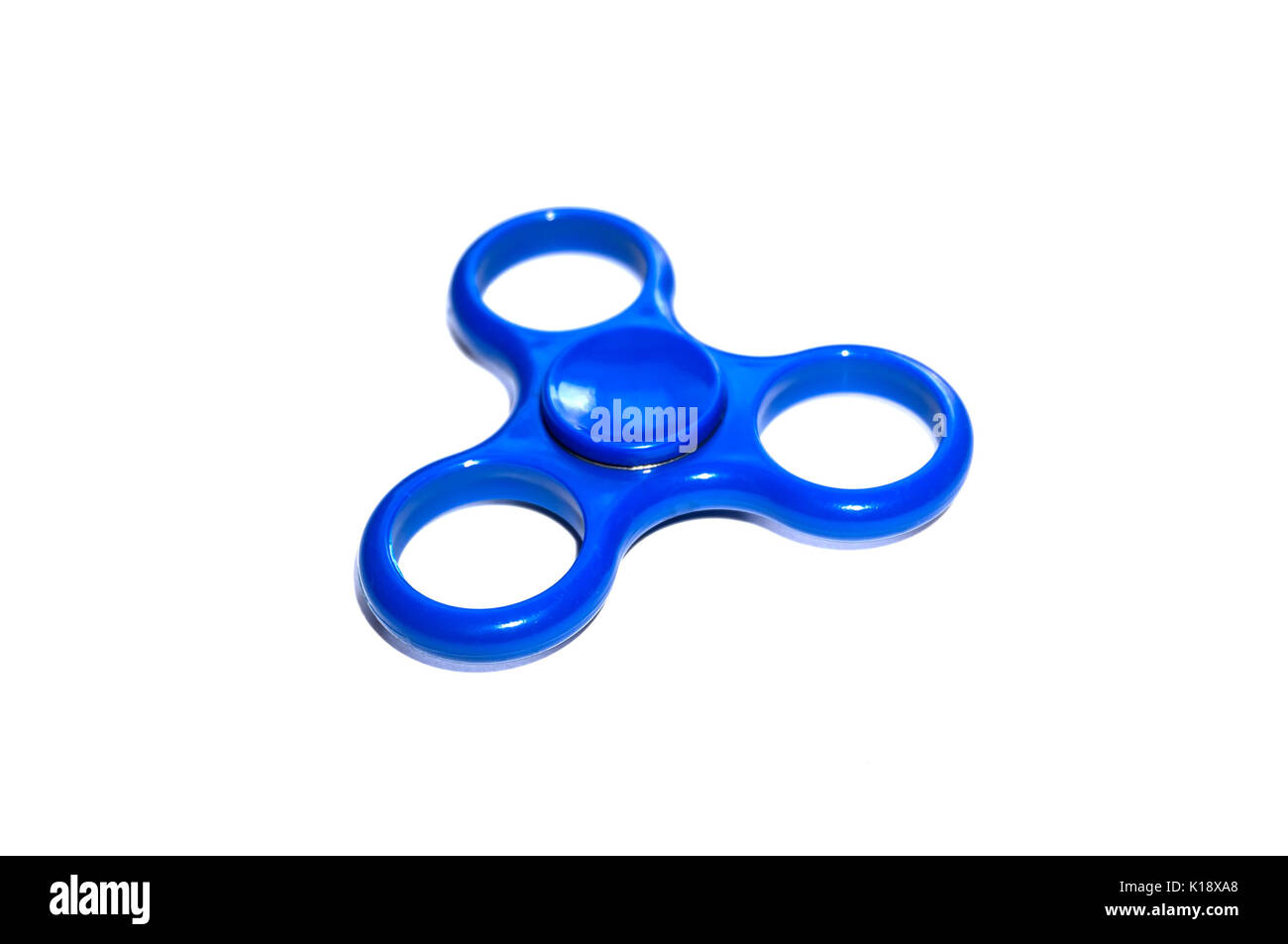 Dito blu spinner stress ansia giocattolo di rilievo isolato su sfondo bianco. Vista aerea. Potente spinner. Potente spinner spinner, Twister per ha Foto Stock