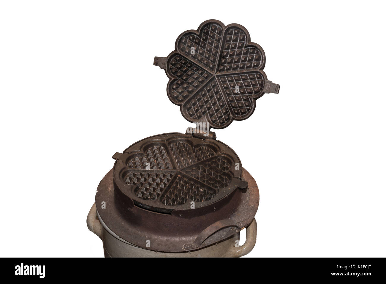 Macchina per waffle in ghisa antica per il caminetto. Foto Stock