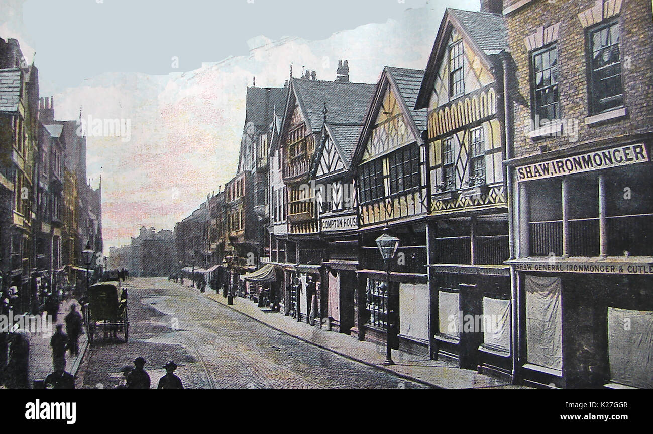 1922 - La città di Chester, Inghilterra, mostrando antichi negozi con tende da sole, Shaw Ironmonger e Compton House (Color /colore) Foto Stock