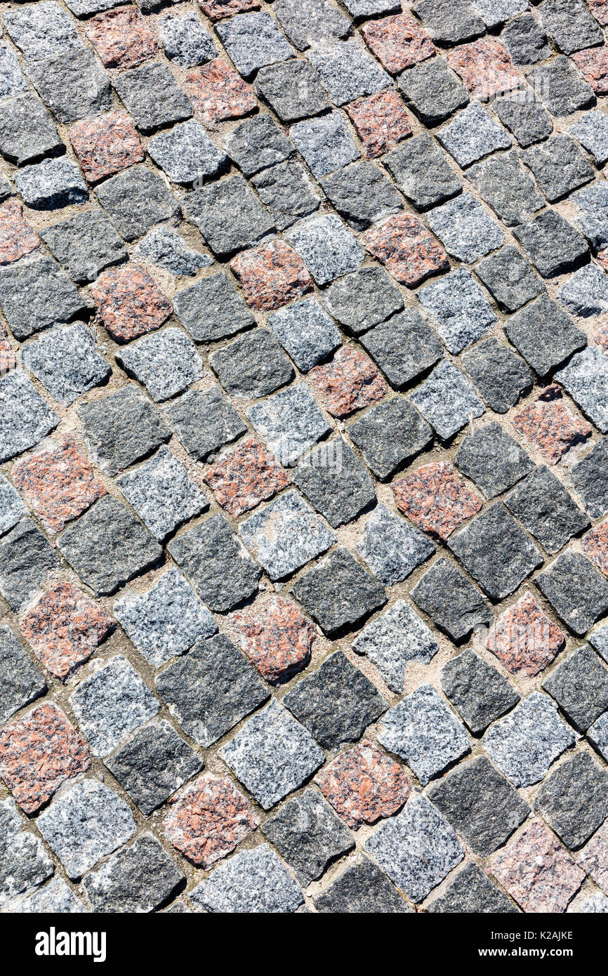 Vecchio grigio granito naturale cobblestone pavement sfondo vista da sopra Foto Stock