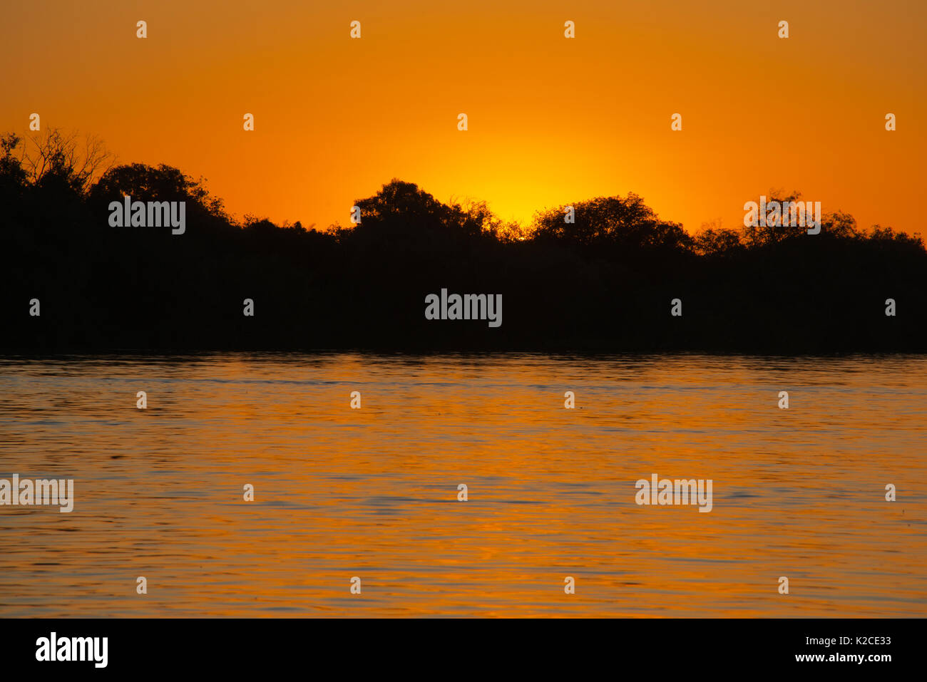 Tramonto sul fiume Zambesi Zambia Foto Stock