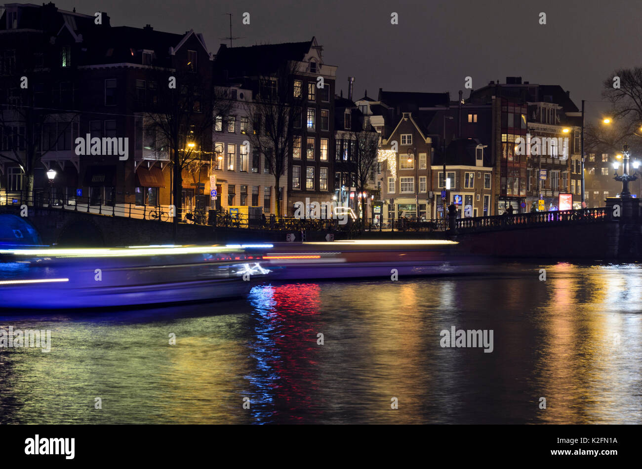 Tracce di luce di battelli, Amsterdam, Paesi Bassi Foto Stock