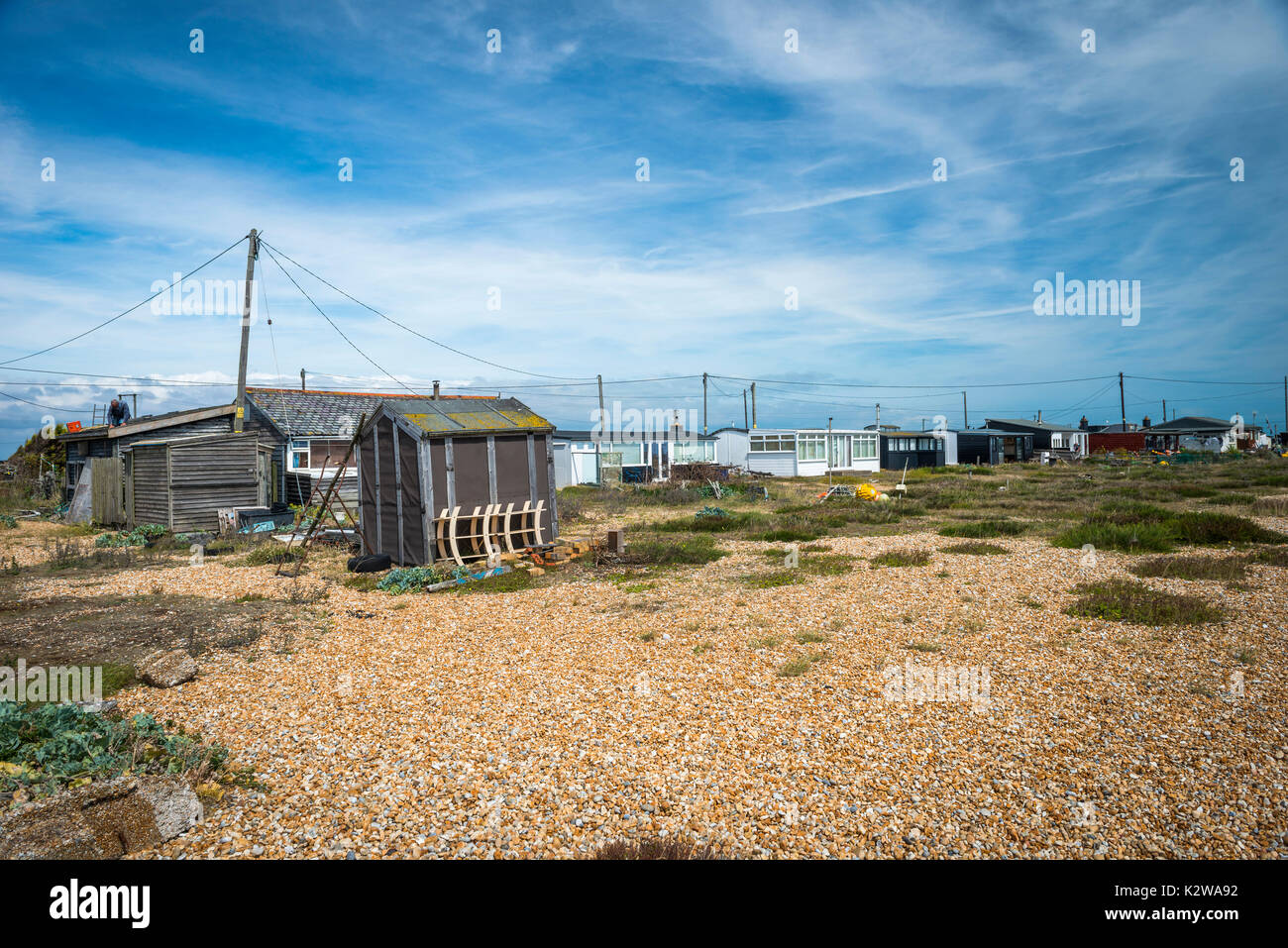 Vecchia carrozza ferroviaria case sul promontorio di Dungeness, Kent, Regno Unito Foto Stock