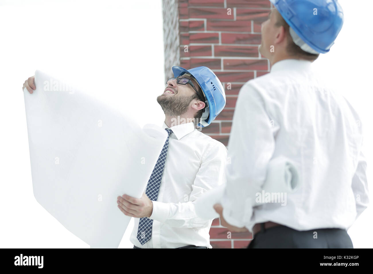 Architetto e il caposquadra della stima di costruzione nuovo edificio Foto Stock