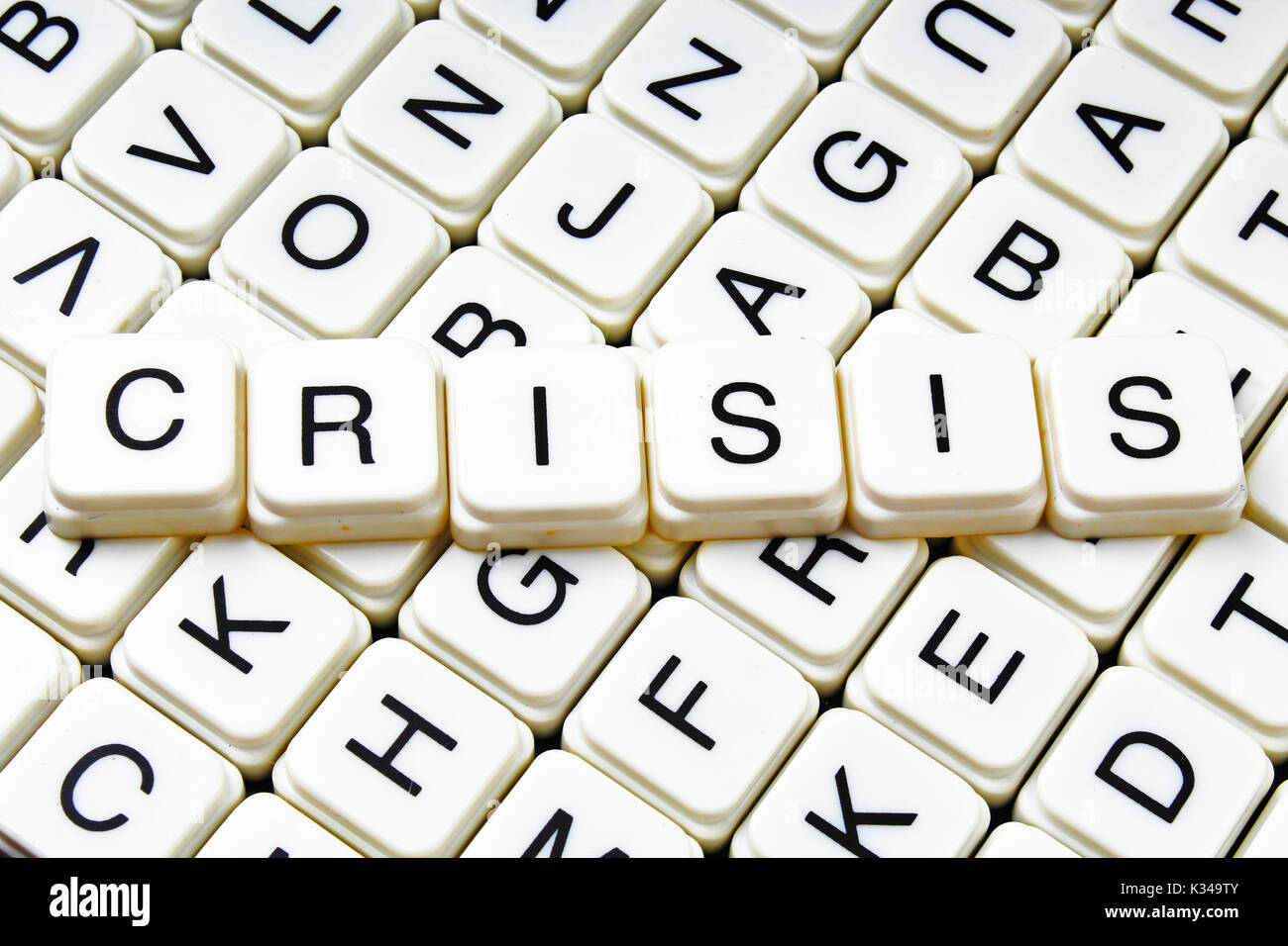 Crisi di testo parola cruciverba. Lettere dell'alfabeto blocchi texture di gioco dello sfondo. Foto Stock