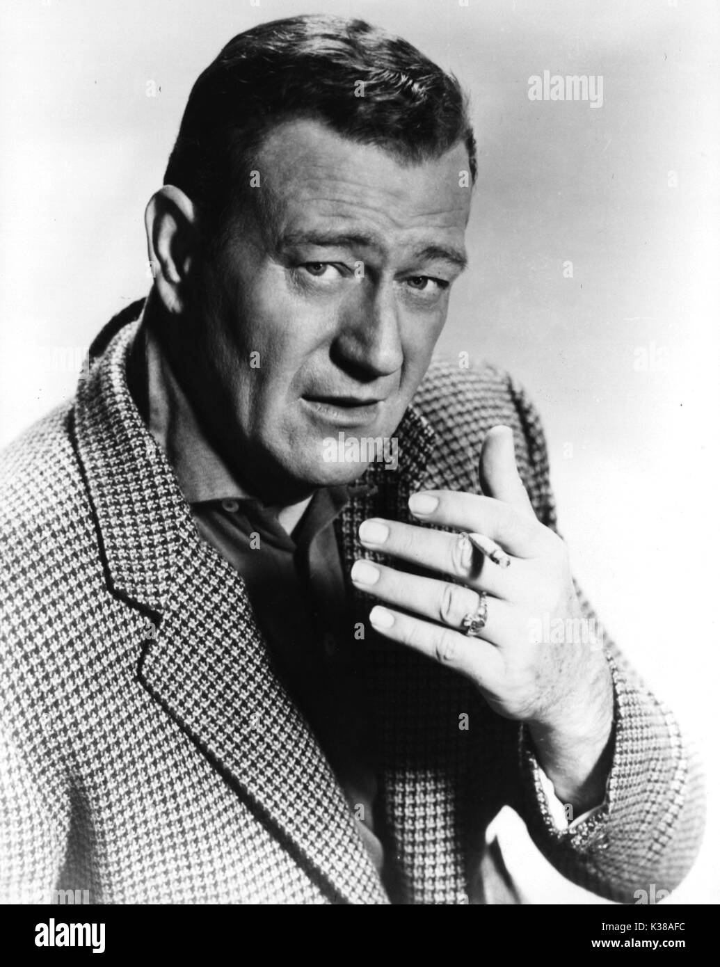 JOHN WAYNE fumatori Foto Stock