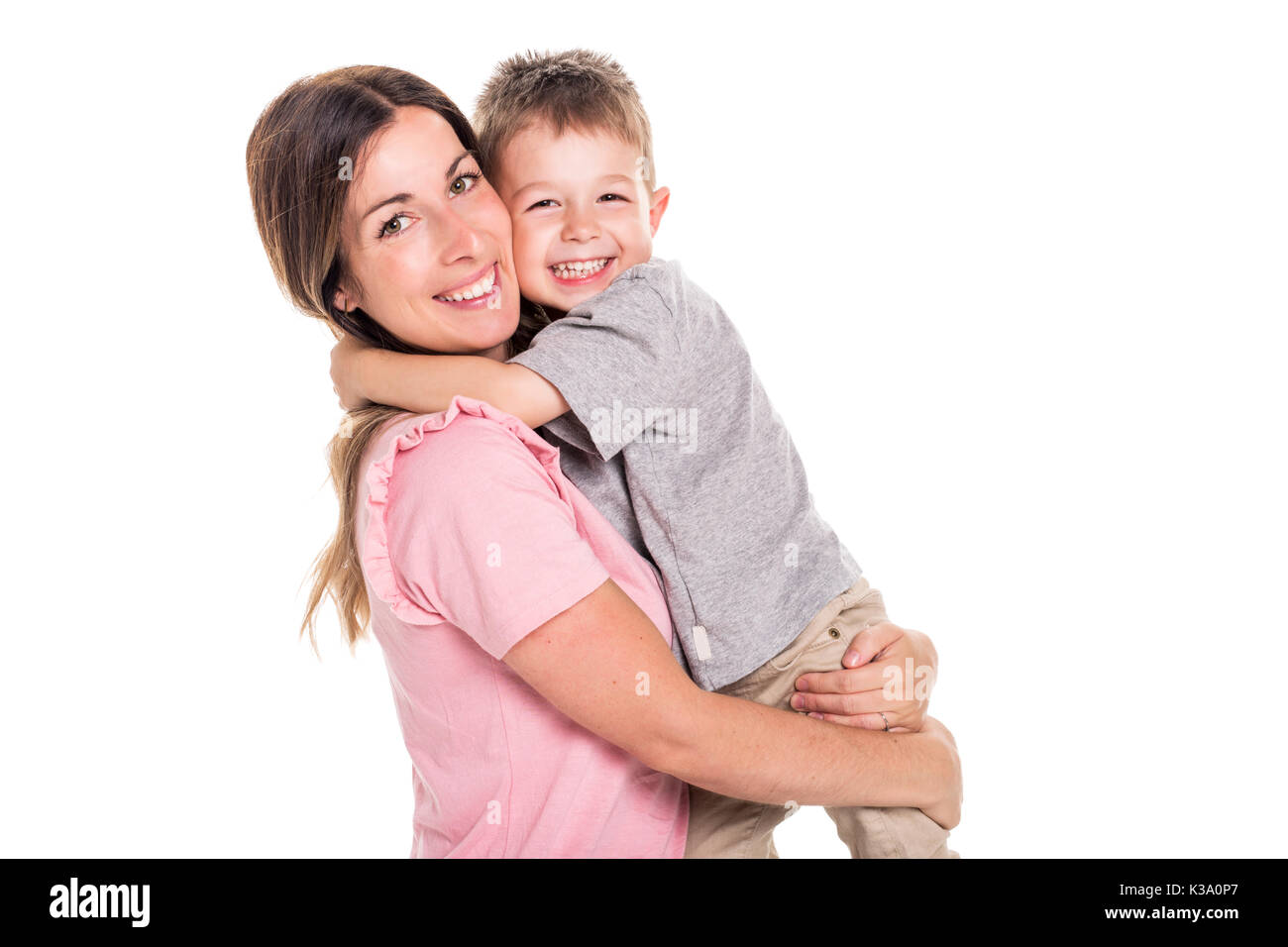 Felice giovane madre con un bambino su sfondo bianco Foto Stock