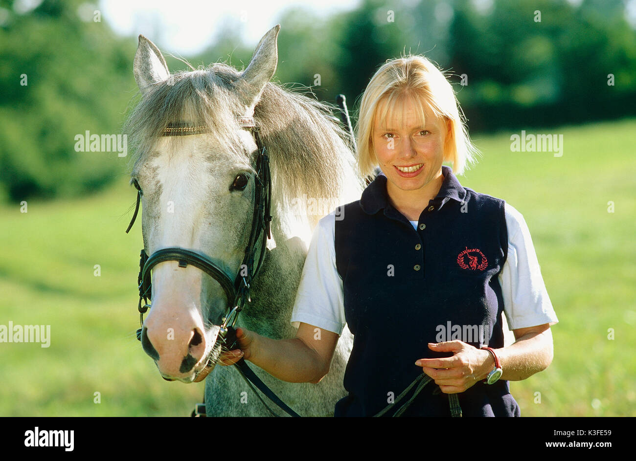 Donna con cavallo Foto Stock