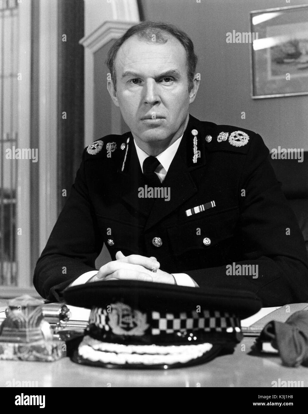 Il direttore TIM PIGOTT-SMITH come Chief Constable John Stafford Foto Stock
