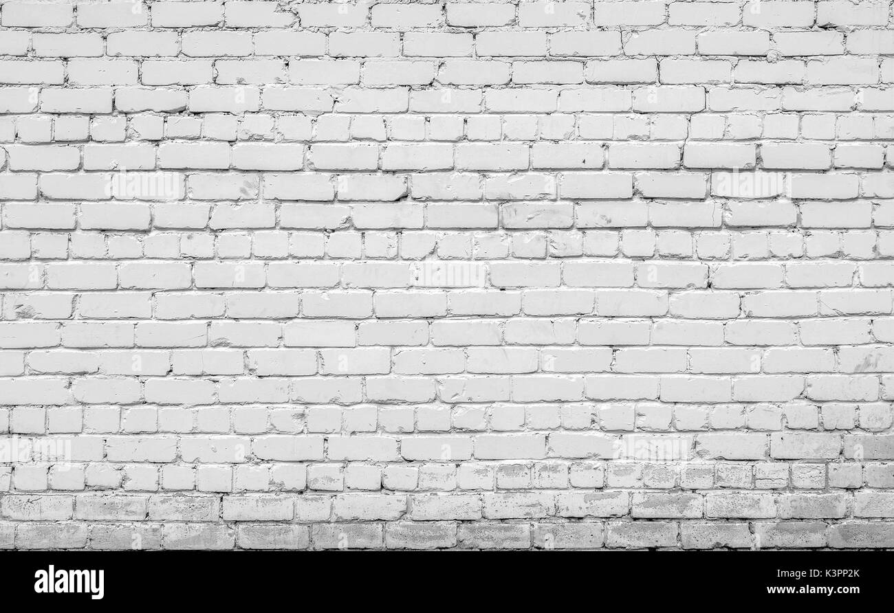 Mattoni su parete in cemento sporco sfondo texture Foto Stock