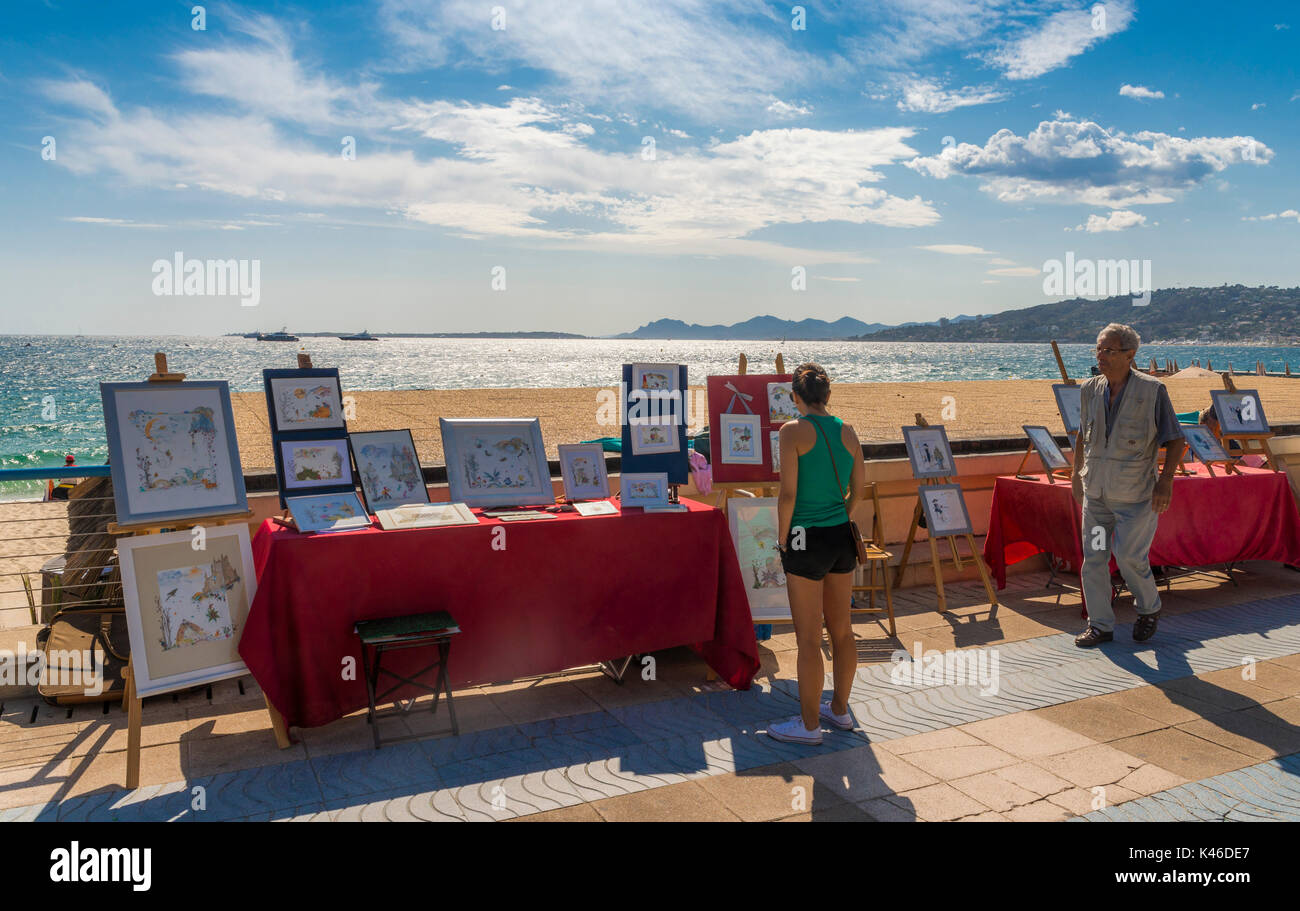 Disegni e illustrazioni per vendita lungo la spiaggia di Juan les Pins, Cote d'Azur, in Francia Foto Stock