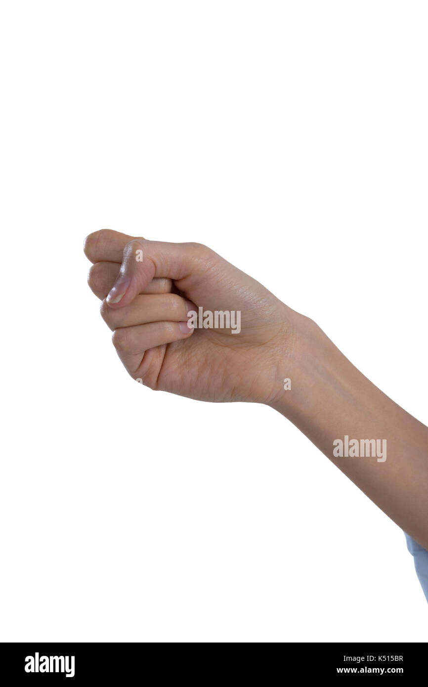 Womans mano pugno di formatura contro uno sfondo bianco Foto Stock