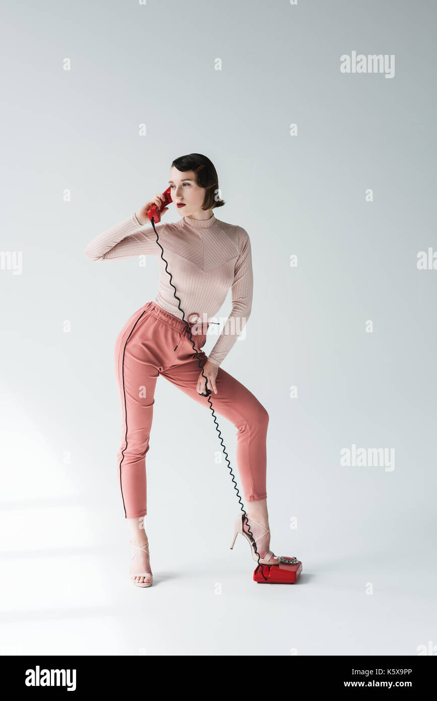 Donna elegante con retro telefono Foto Stock Donna elegante con retro telefono Foto Stock