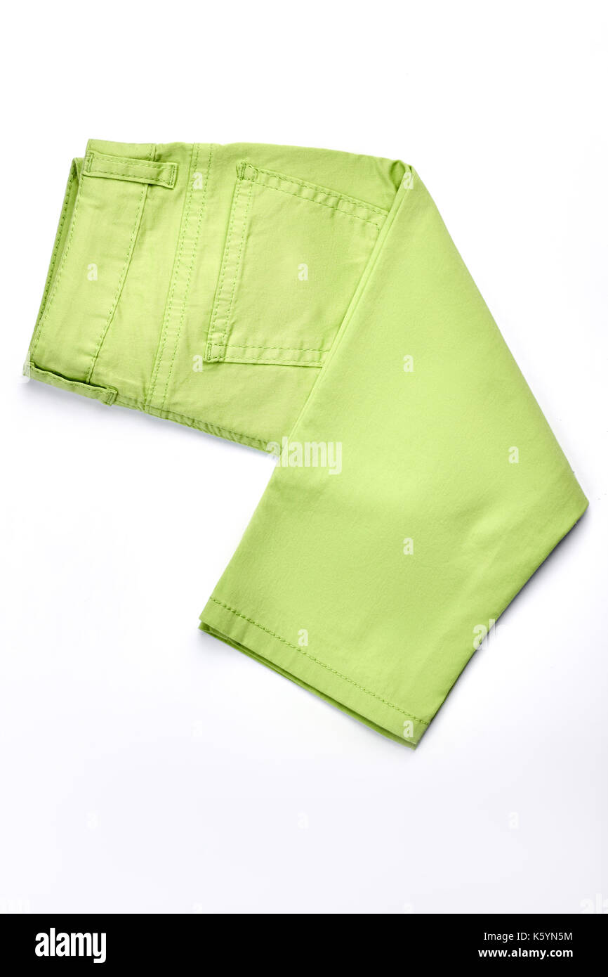 Baby-girl nuovo jeans colorati. neonato ragazza verde chiaro pantaloni di  cotone ripiegata su sfondo bianco, vista dall'alto Foto stock - Alamy