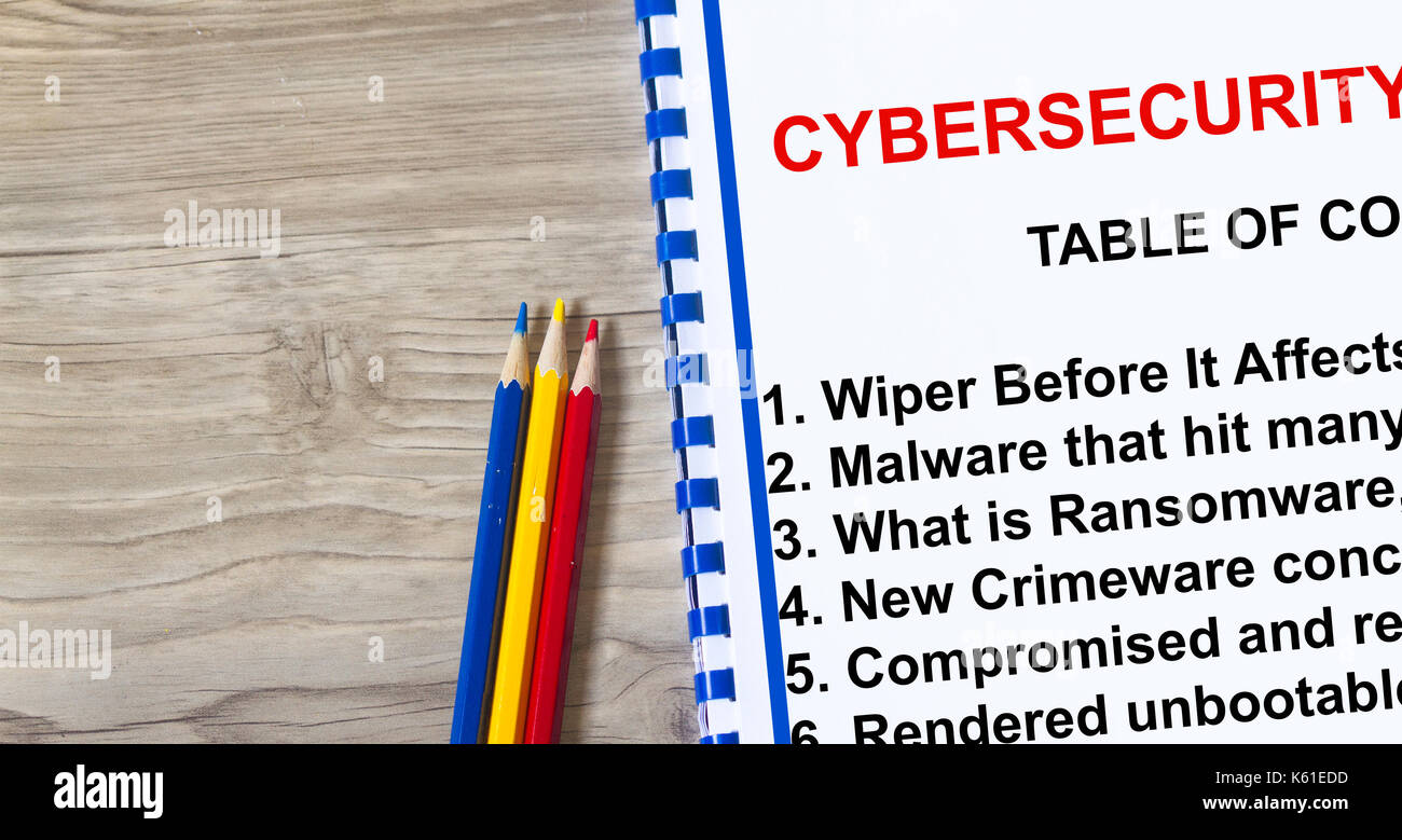 Sicurezza informatica ransomware e tergicristalli sono virus più recenti sul ceybernet- con argomenti su un foglio di copertura. Foto Stock