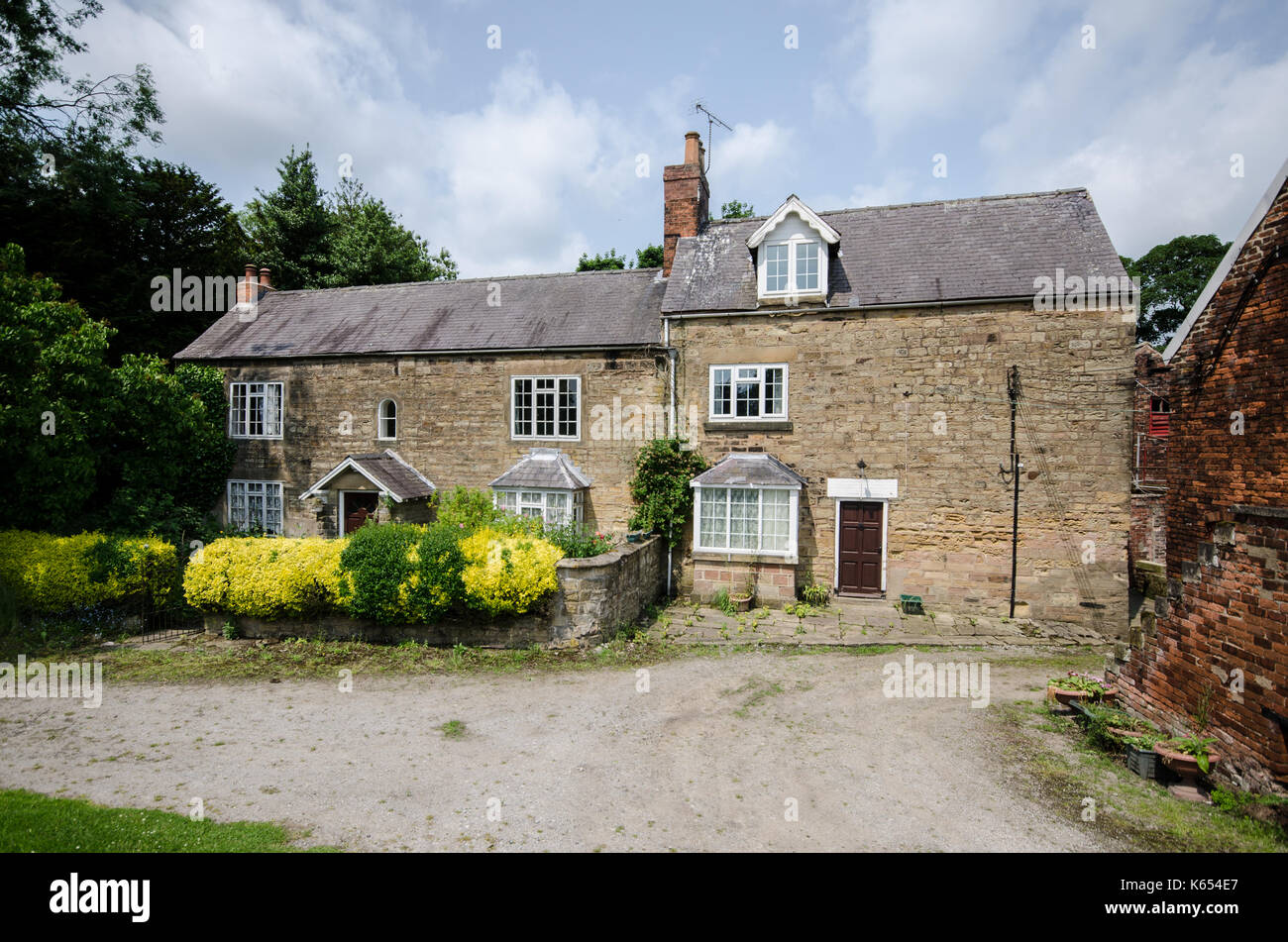 A 3 piani Derbyshire casale in pietra Foto Stock