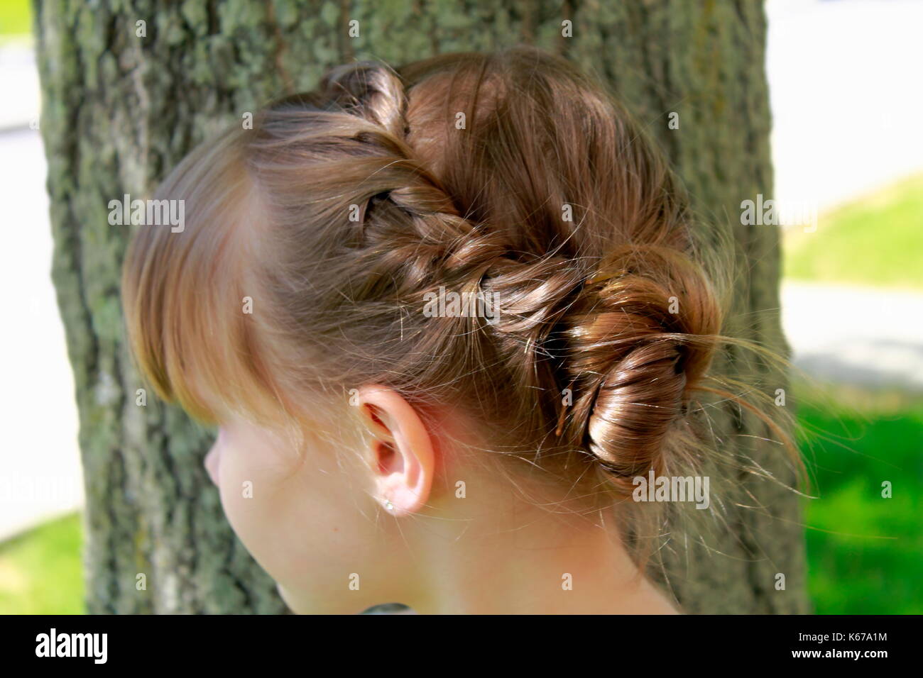 Ritratto di una ragazza con i capelli intrecciati Foto Stock