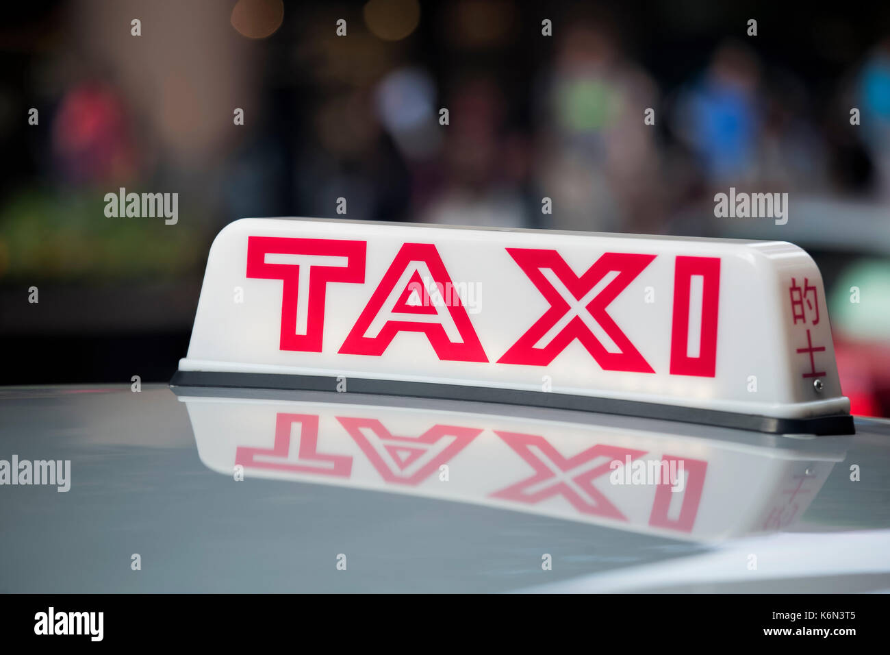 Taxi segno sul tetto di un taxi a hong kong Foto Stock