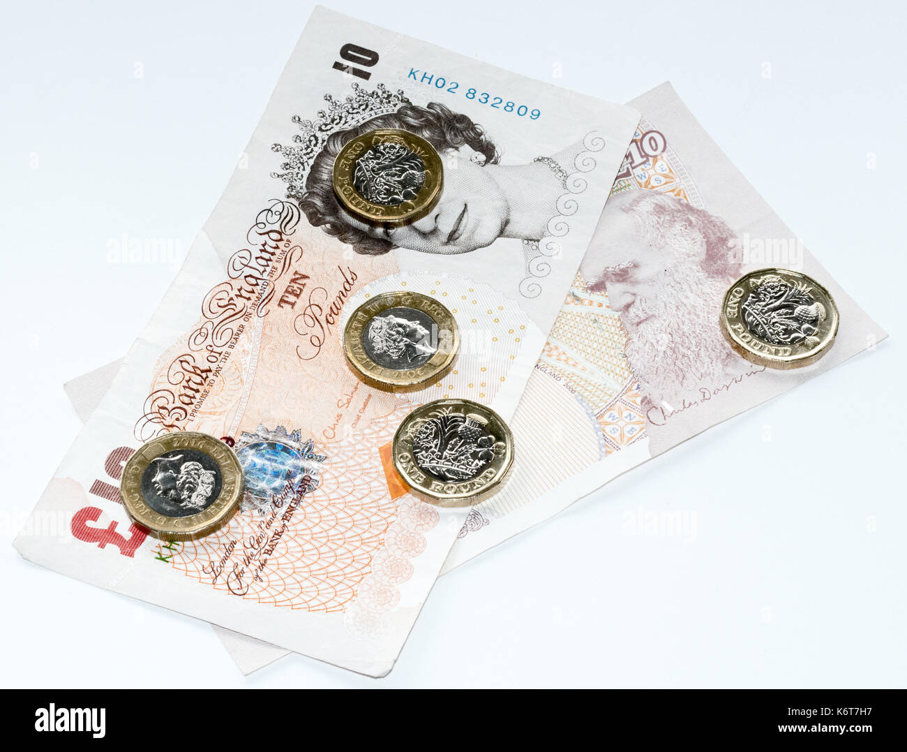 £10 nota e una moneta pund Foto Stock