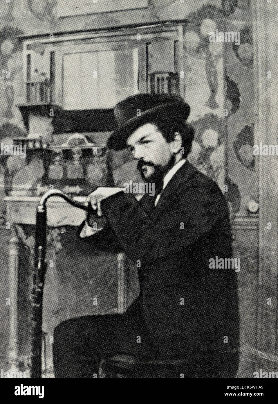 DEBUSSY, Claude - nel 1894 appoggiato su di clarinetto basso. Tempo di 'Prélude à l'Après-Midi' d'onu Faune. Il compositore francese (1862-1918) Foto Stock