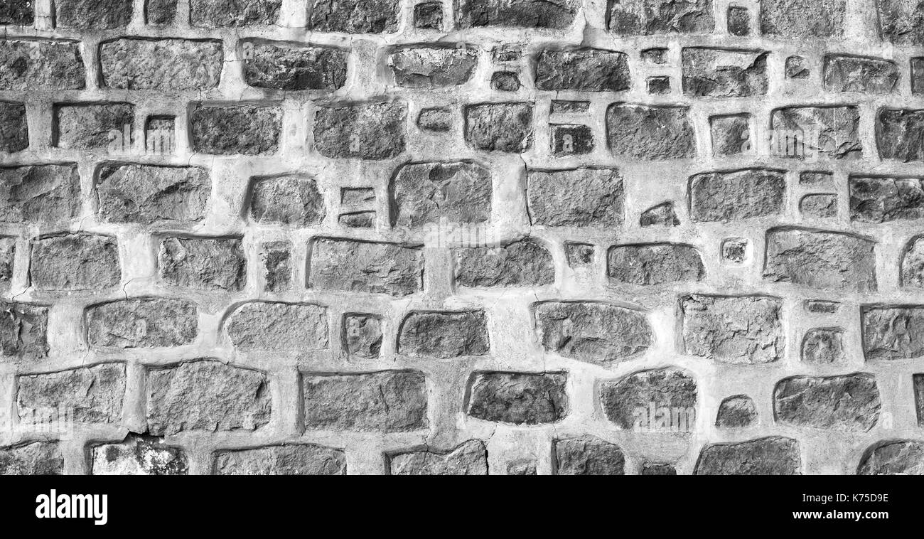 Foto di sfondo texture, grigio antico muro di pietra Foto Stock