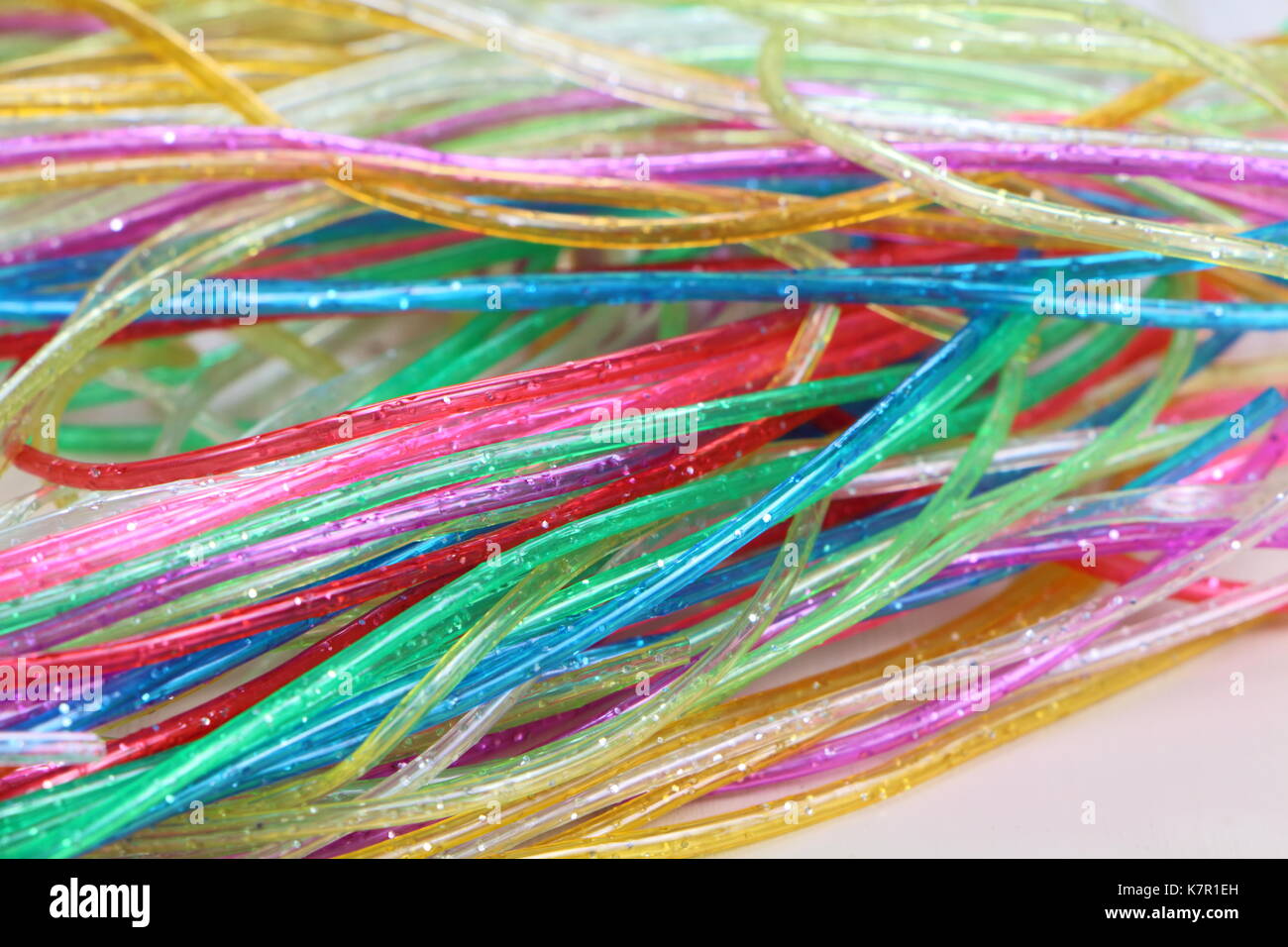 Scoubidou plastica stringhe di colori fluorescenti Foto Stock