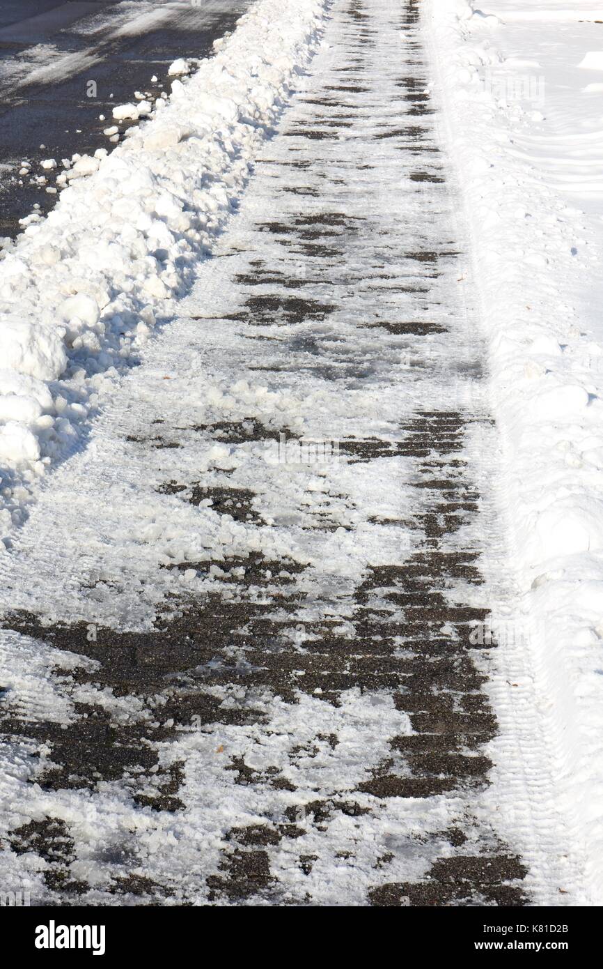 Marciapiede smerigliato in inverno Foto Stock