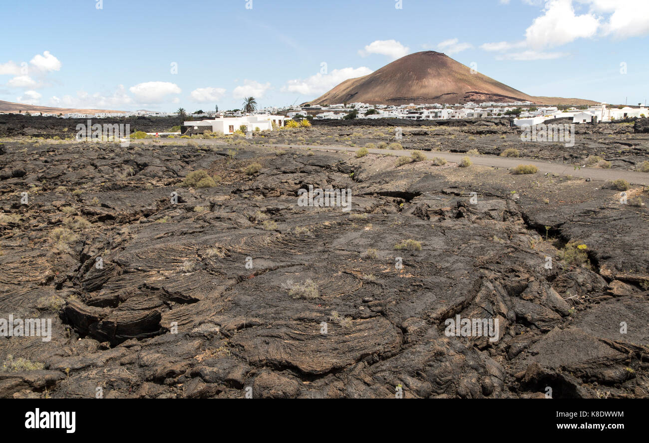 Pahoehoe solidificato o ropey campo di lava, Tahiche village, Lanzarote, Isole Canarie, Spagna Foto Stock