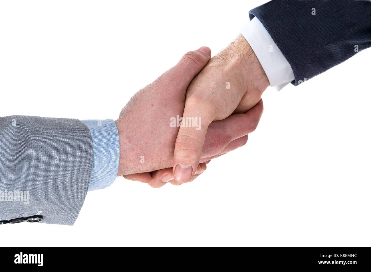 Due uomini di affari stringono le mani Foto Stock