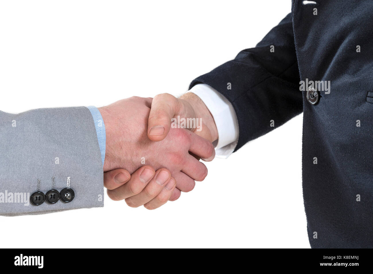 Due uomini di affari stringono le mani Foto Stock