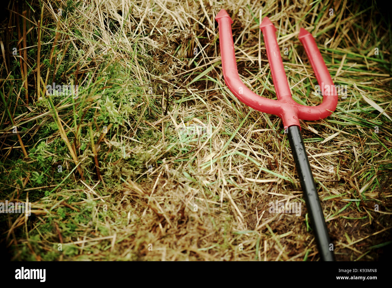 I diavoli del giocattolo di plastica tridente rosso Foto Stock
