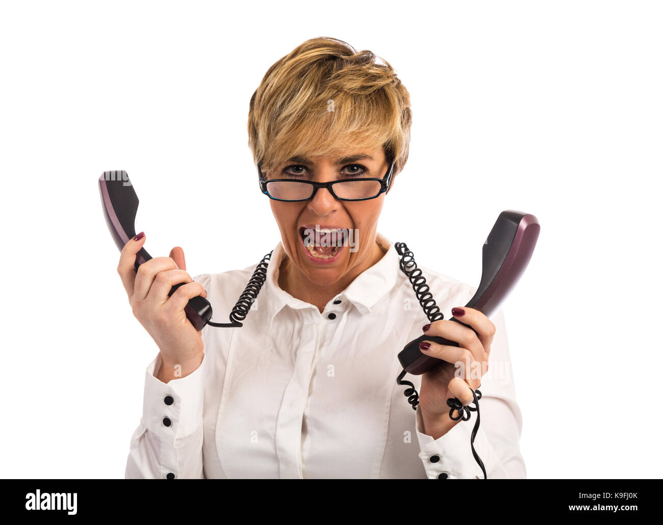 Un oberati di lavoro business donna lotte con troppi telefoni Foto Stock