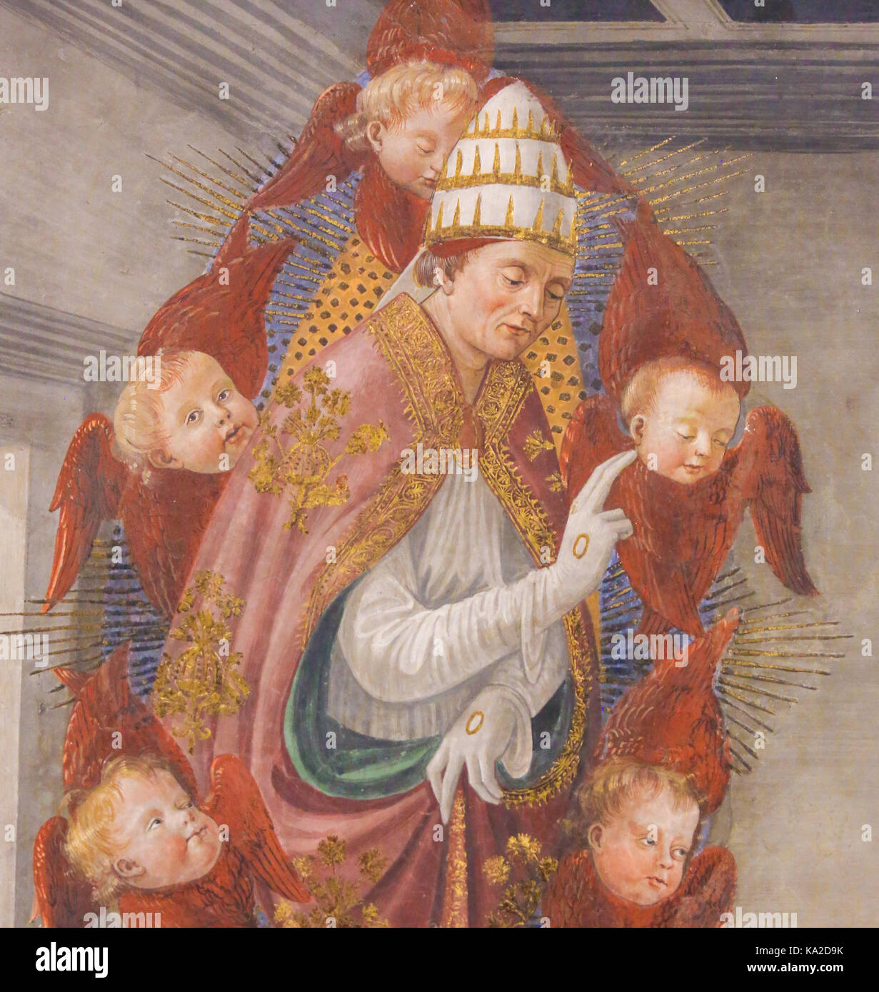 Affresco (1478) raffigurante san Gregorio Magno, supportati da red-cherubini alati, nella collegiata di san gimignano, Italia. Foto Stock