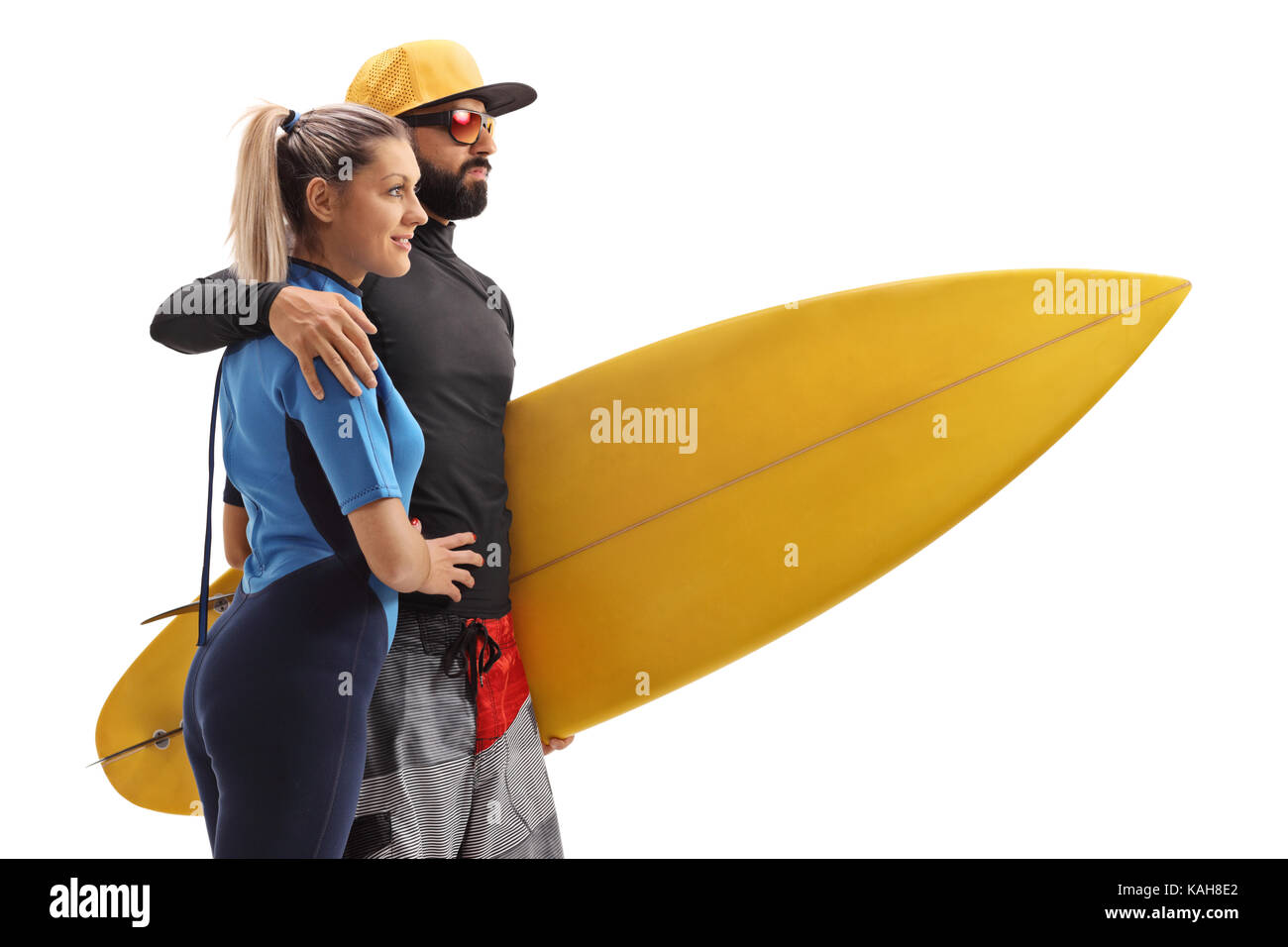 Femmina e un maschio surfer con una tavola da surf isolati su sfondo bianco Foto Stock