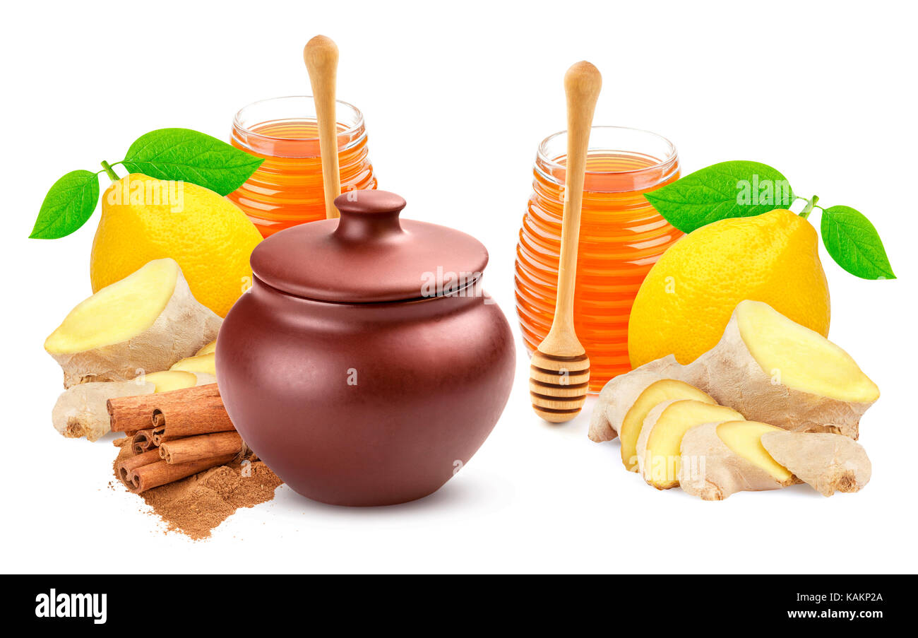 Le spezie per il tè: miele, lo zenzero e il limone isolati su sfondo bianco Foto Stock