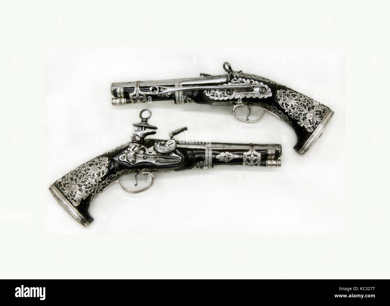 Coppia di Miquelet Flintlock Pistols, datata 1757, coloniale spagnolo, probabilmente il Messico, acciaio, legno (Famiglia leguminosae), argento Foto Stock