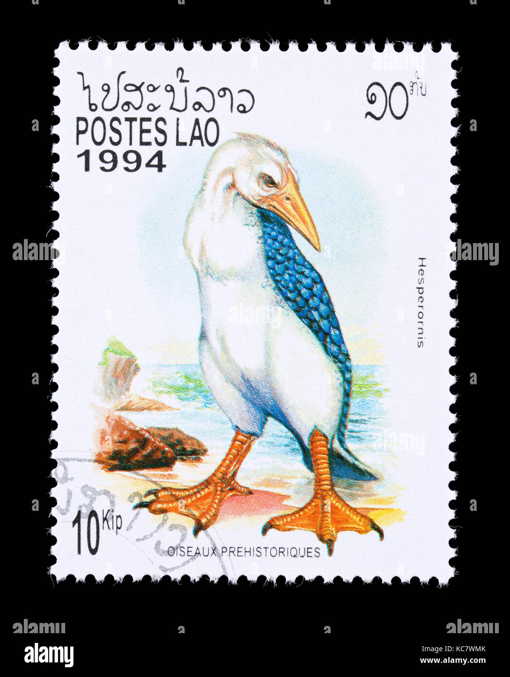 Francobollo dal Laos raffigurante un Hesperornis, grandi flightless estinti gli uccelli acquatici Foto Stock