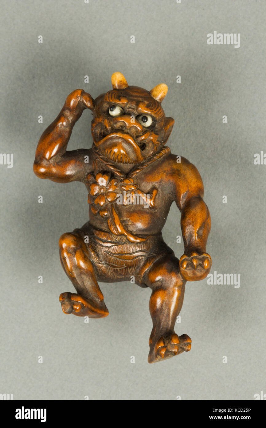 Netsuke di demoni che trasportano una zucca sulla sua schiena, XVIII secolo Foto Stock