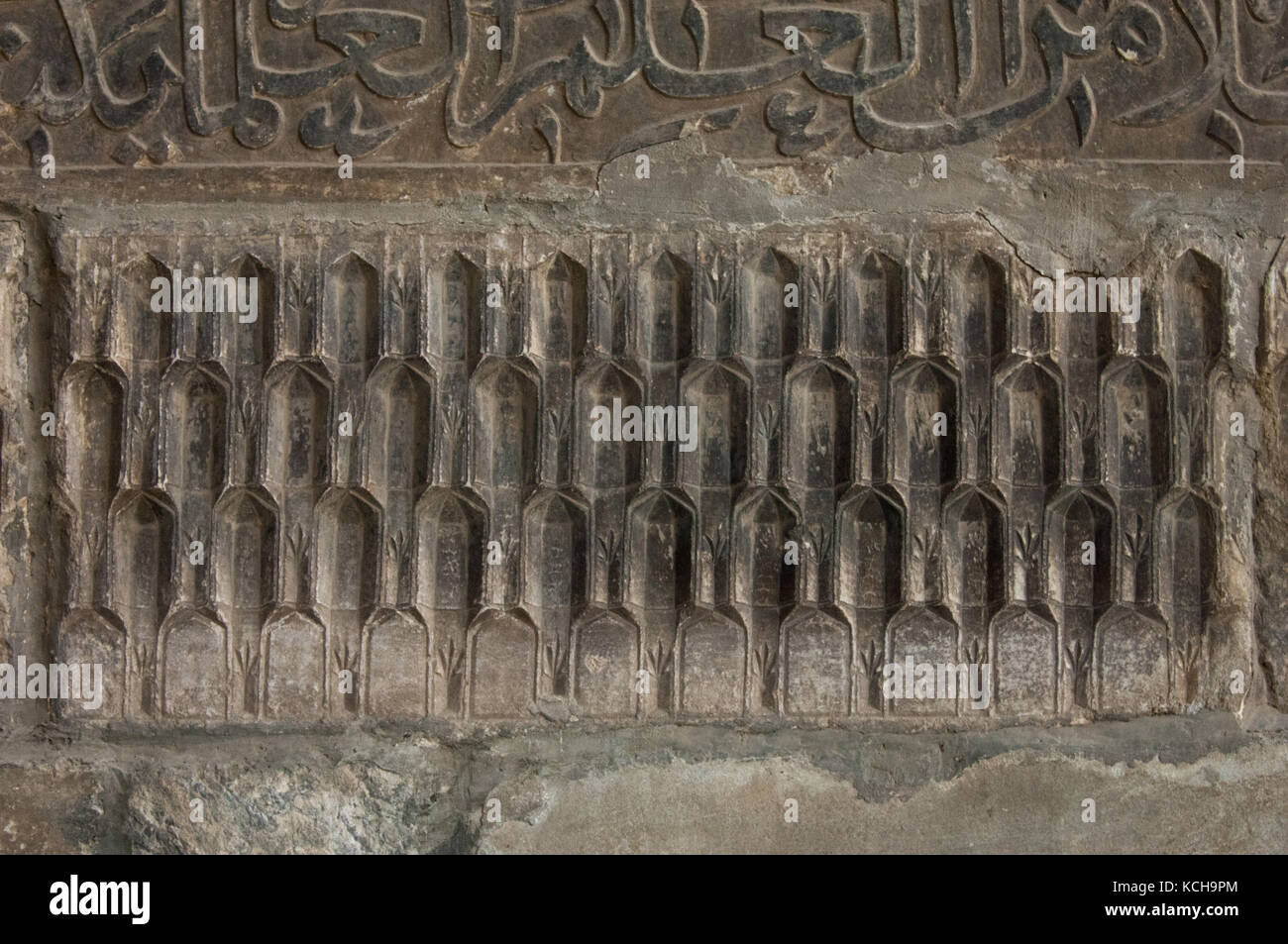 Antica scrittura araba sulla parete Foto Stock