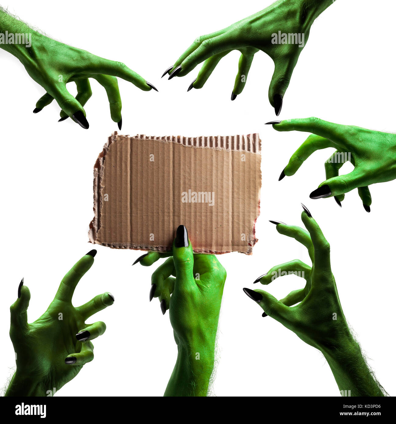 Halloween streghe verdi o zombie monster mano che tiene un cartello bianco Foto Stock